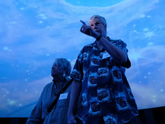 A couple holds hands in Flandrau planetarium 