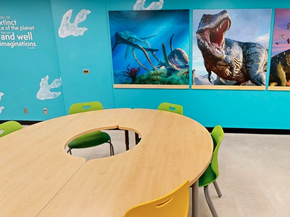 Photo of classroom with dinosaurs on walls