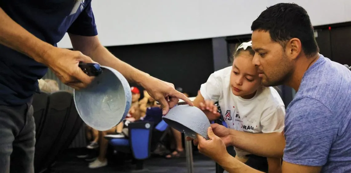 Father-and-Daughter-learn-about-the-moon-in-Flandrau-Planetarium-in-Tucson 